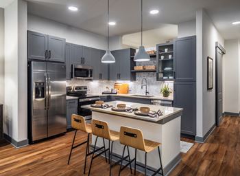 Aura thirty2 new apartments in austin, texas model kitchen with island
